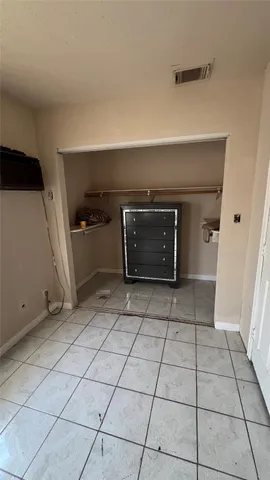 a view of an empty room and fire place