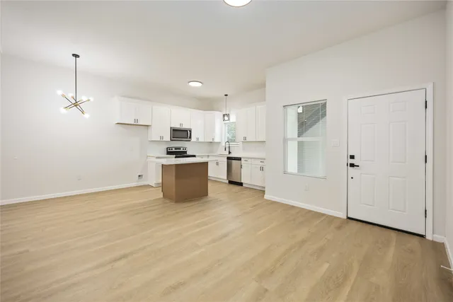 a view of kitchen with wooden floor