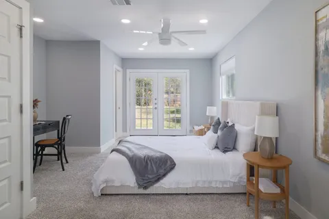 a bedroom with a bed and a chair