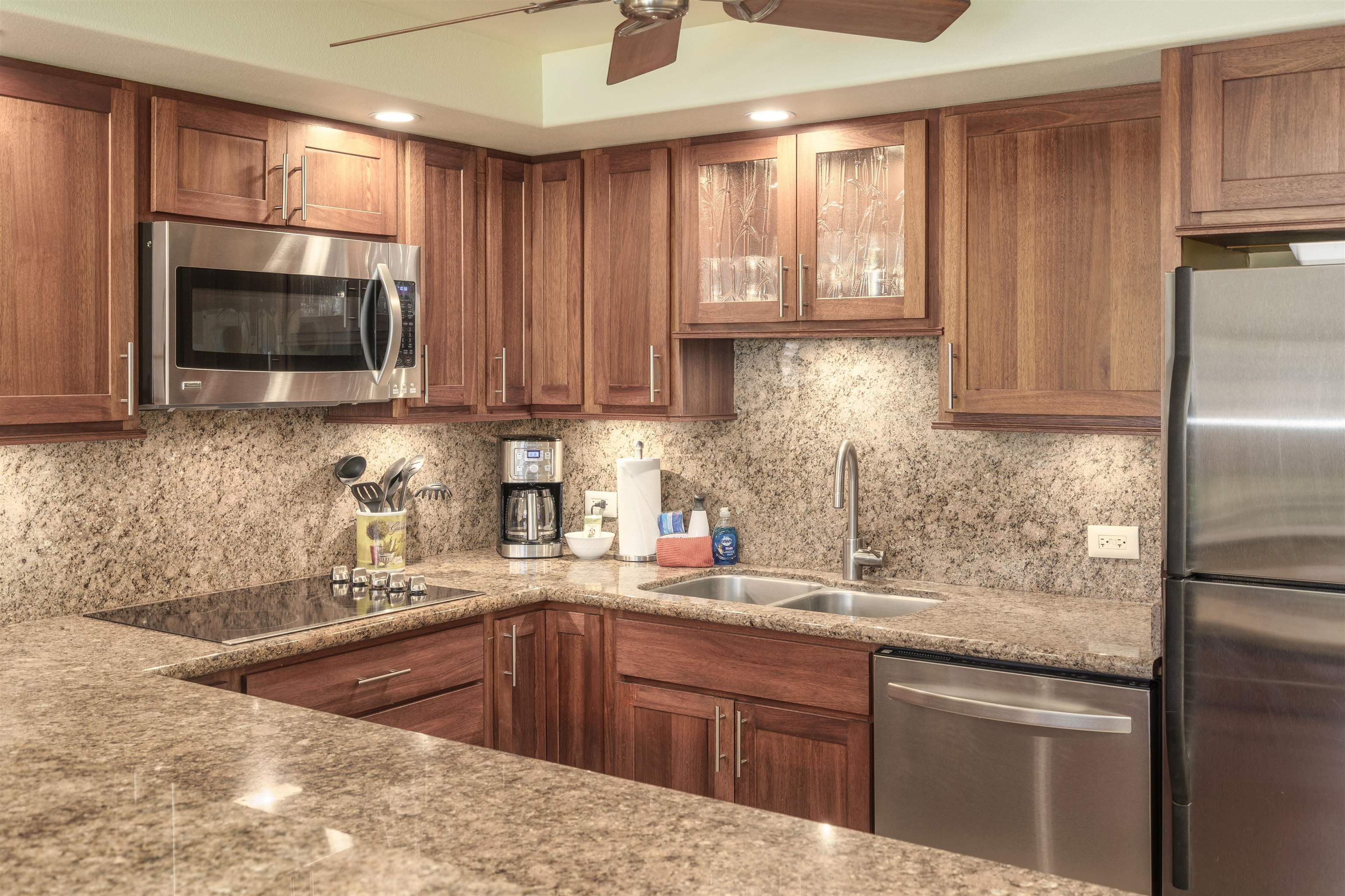2695 South Kihei Road, Unit 2102 Kihei, HI 96753 - Photo 11 of 35 a kitchen with stainless steel appliances granite countertop a sink stove and microwave