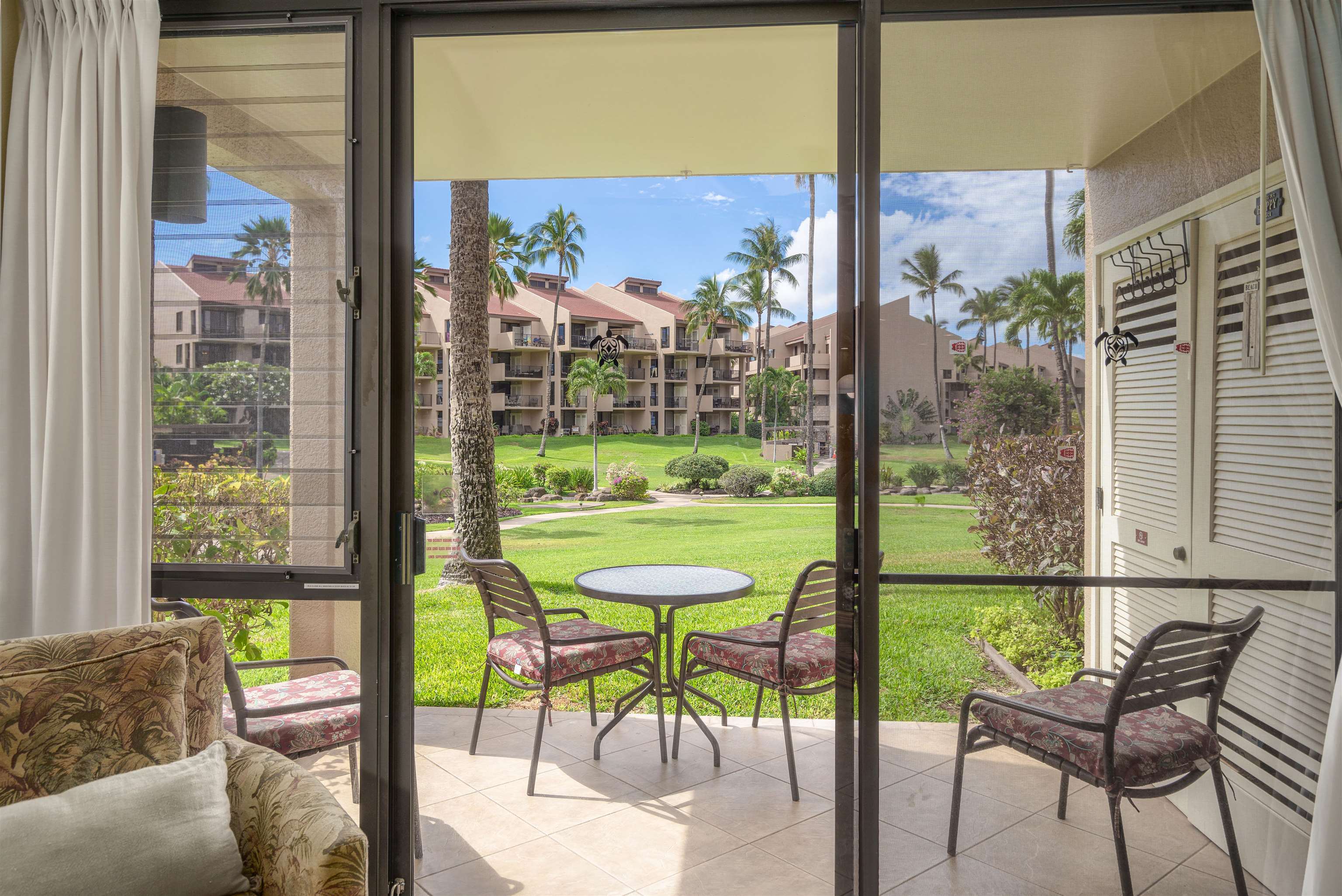 2695 South Kihei Road, Unit 2102 Kihei, HI 96753 - Photo 16 of 35 a view of a city from a dining room with a table and chairs
