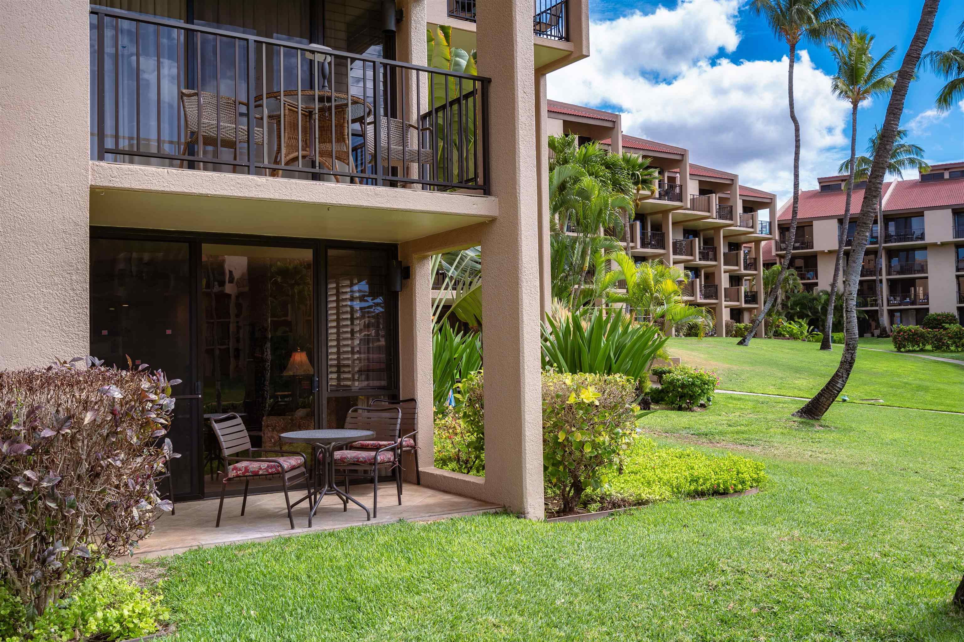 2695 South Kihei Road, Unit 2102 Kihei, HI 96753 - Photo 17 of 35 a view of a chair and table in backyard of the house