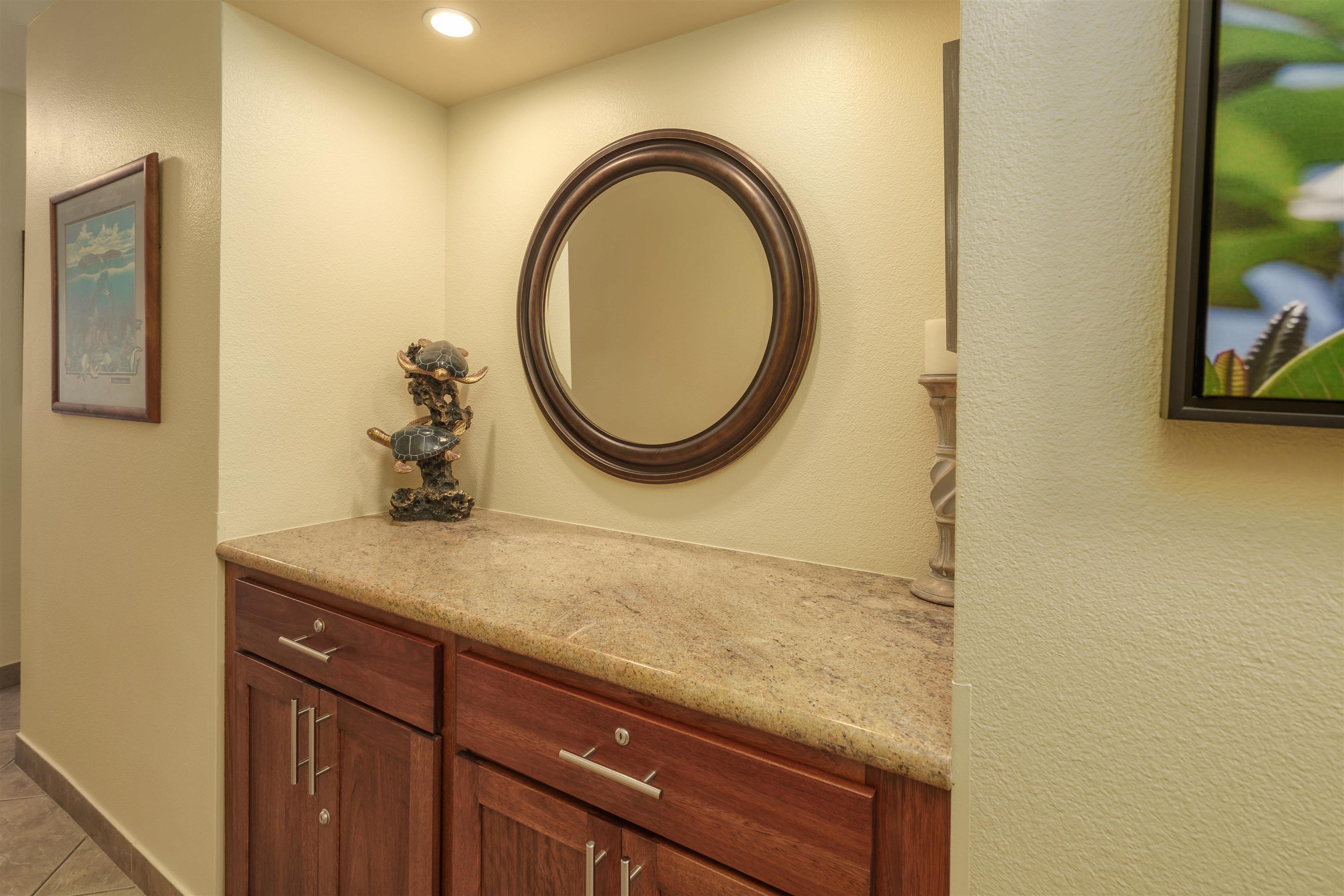 2695 South Kihei Road, Unit 2102 Kihei, HI 96753 - Photo 25 of 35 a bathroom with a granite countertop sink and a mirror