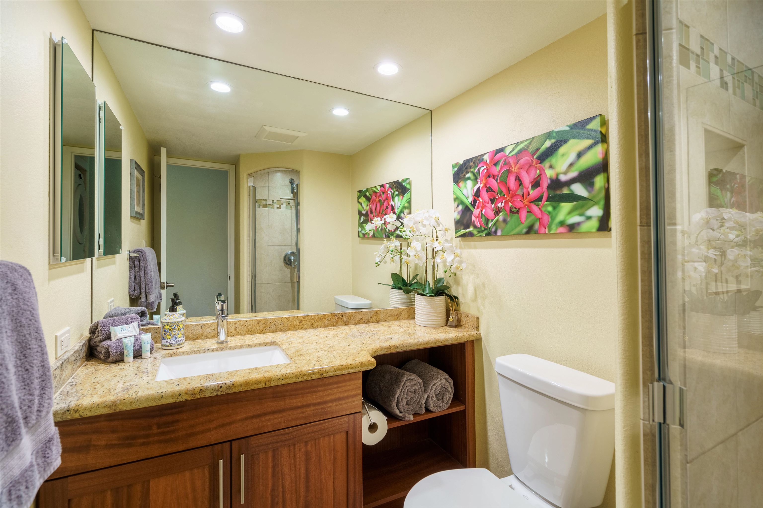 2695 South Kihei Road, Unit 2102 Kihei, HI 96753 - Photo 5 of 35 a bathroom with a granite countertop sink mirror vanity and toilet