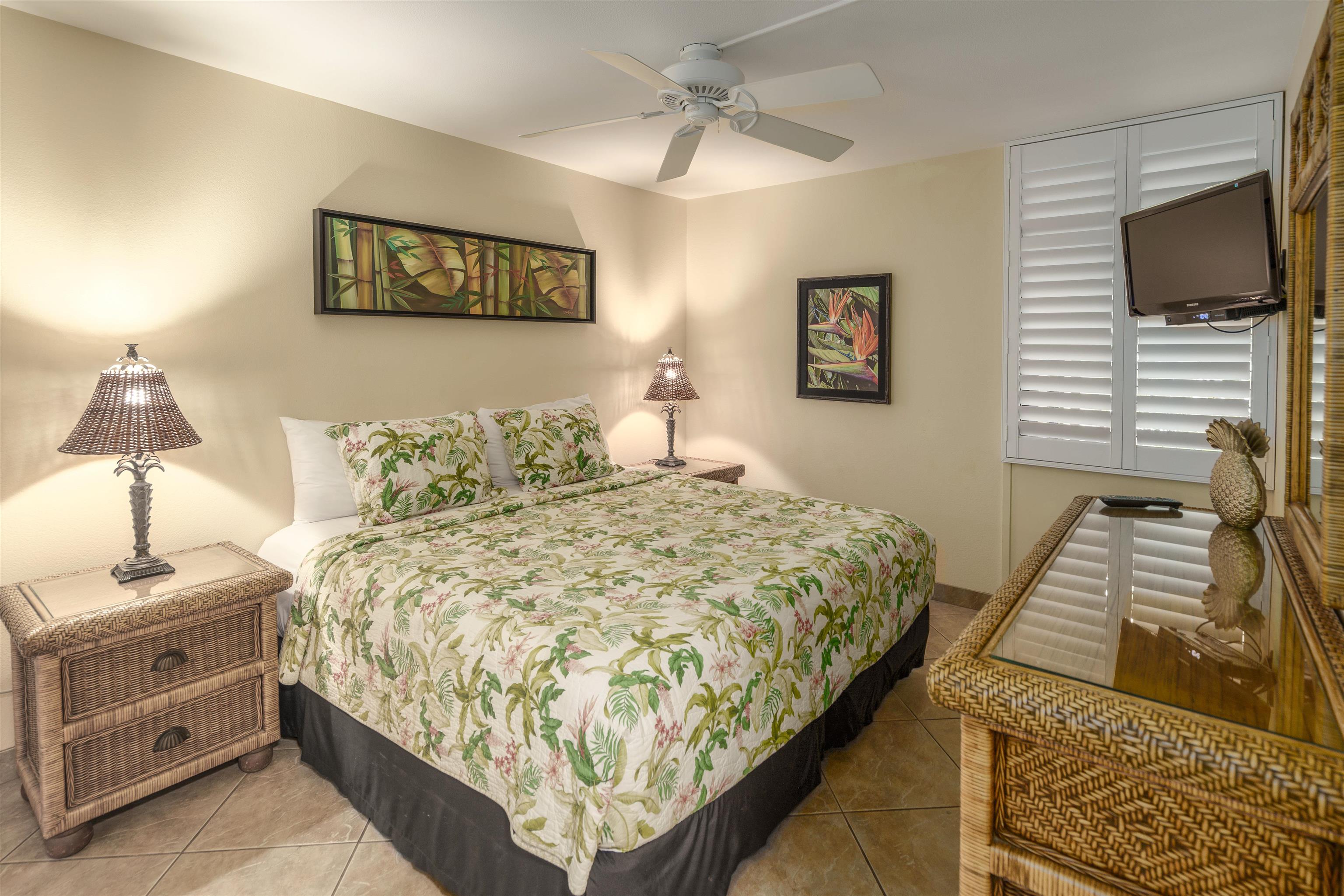 2695 South Kihei Road, Unit 2102 Kihei, HI 96753 - Photo 6 of 35 a bedroom with a bed and a flat screen tv