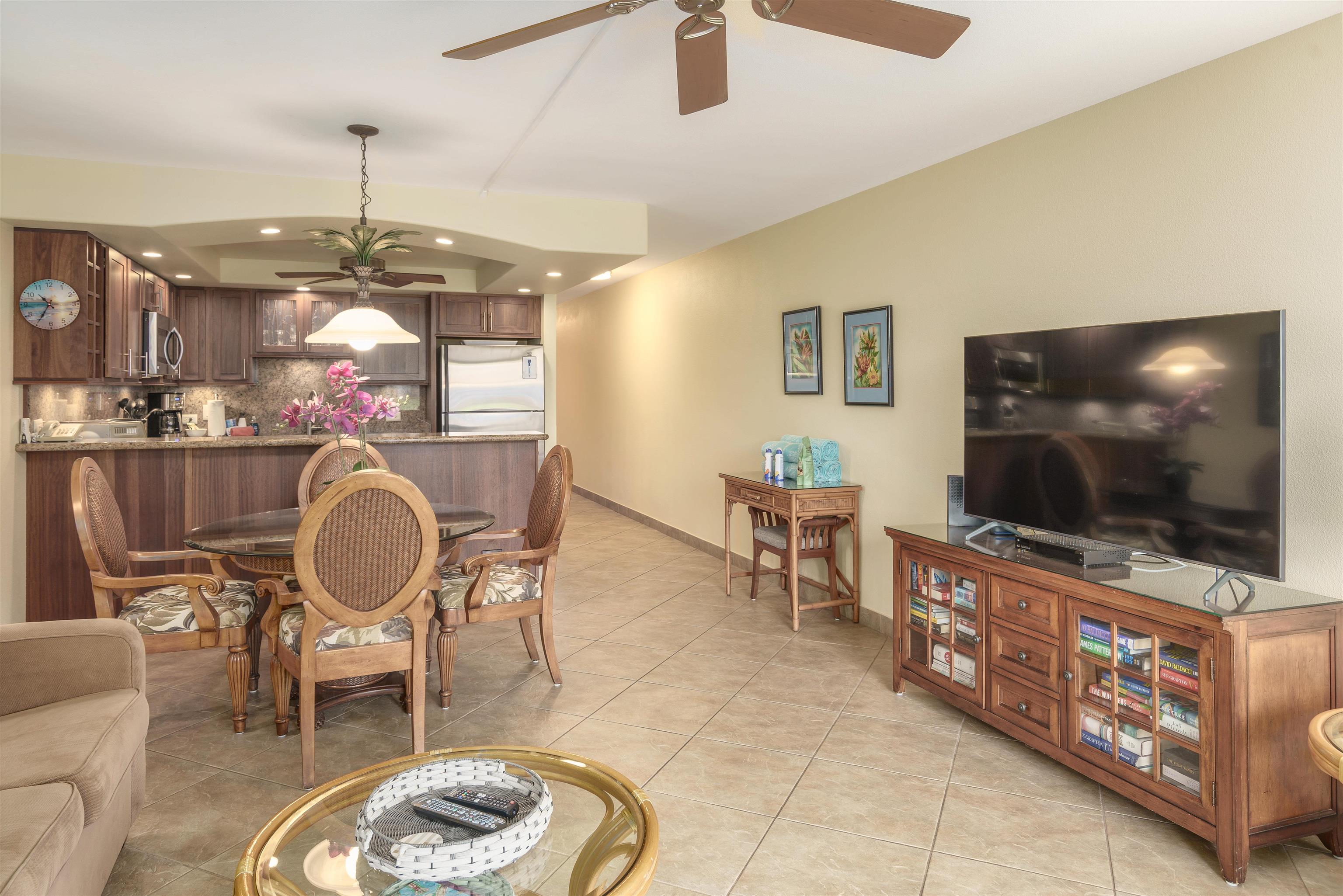 2695 South Kihei Road, Unit 2102 Kihei, HI 96753 - Photo 9 of 35 a living room with furniture and a flat screen tv
