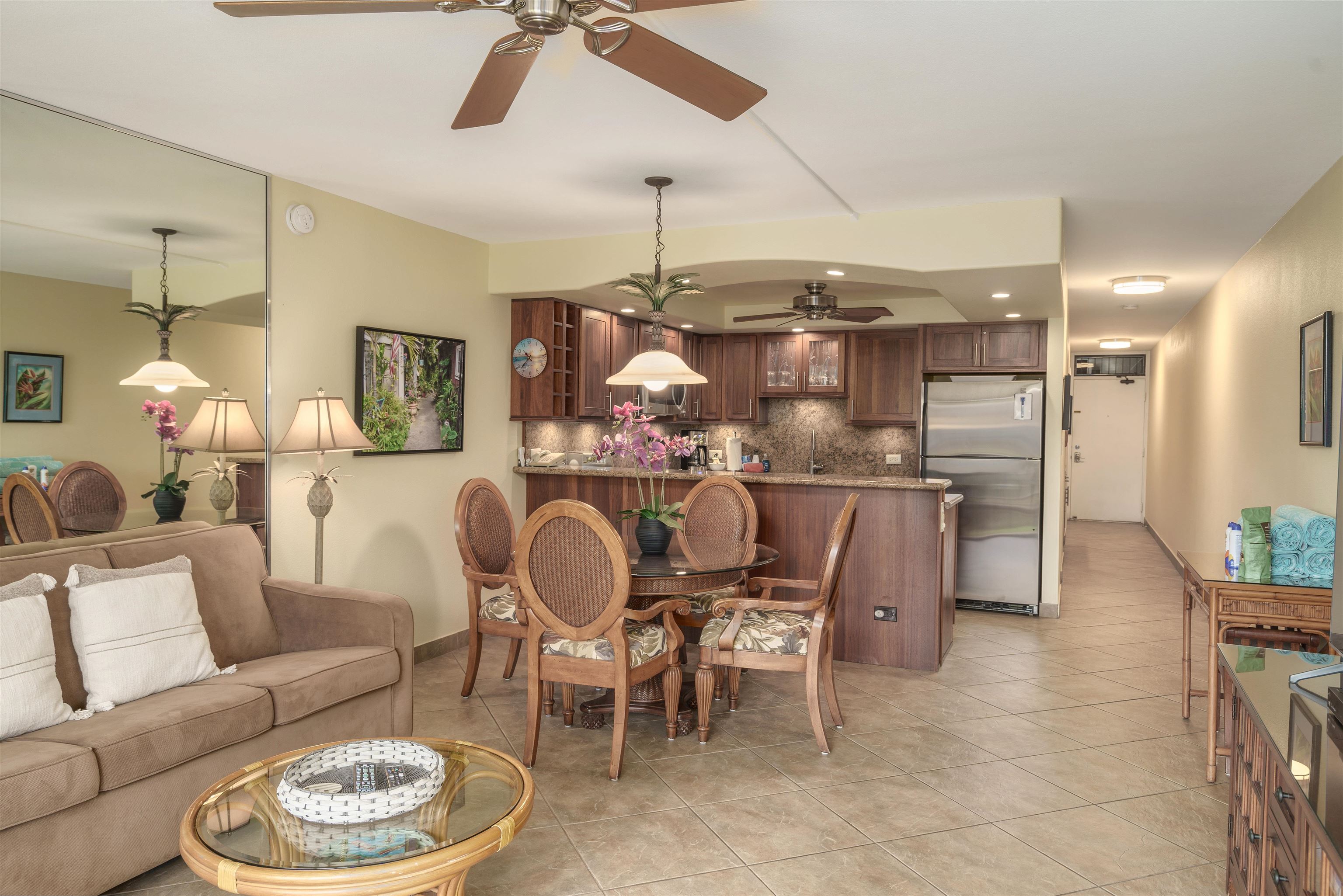 2695 South Kihei Road, Unit 2102 Kihei, HI 96753 - Photo 10 of 35 a dining room with furniture and a chandelier