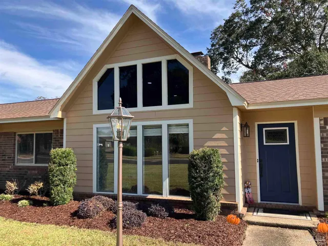 a view of a house with a yard