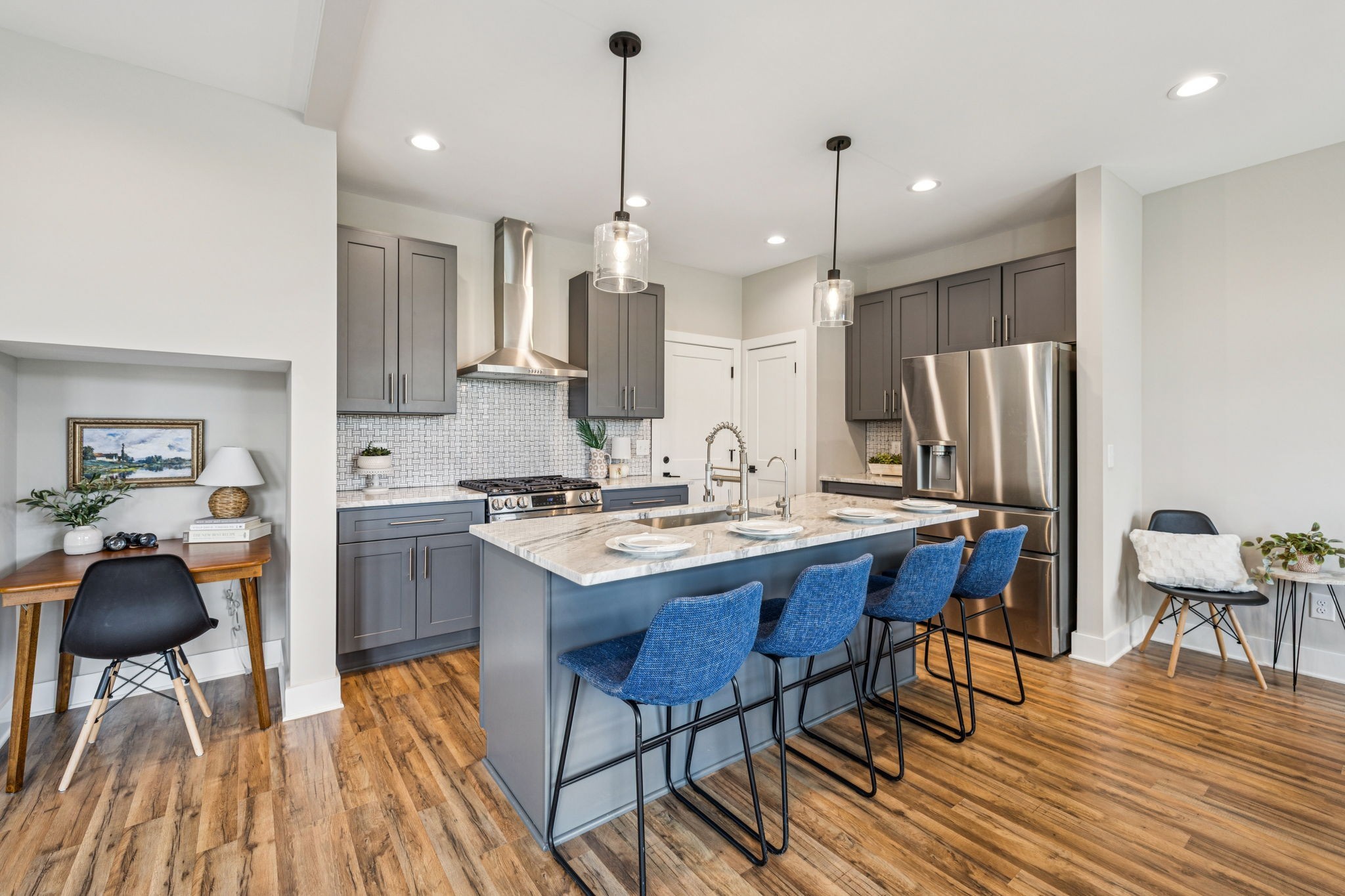 257 B Riverside Drive Nashville, TN 37206 - Photo 11 of 56 a kitchen with stainless steel appliances kitchen island granite countertop a sink refrigerator and cabinets