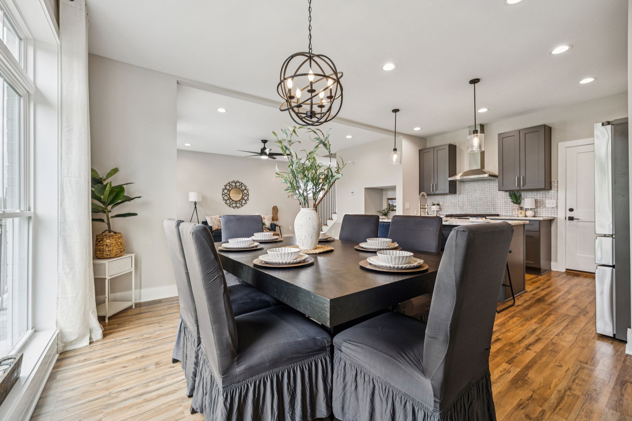 257 B Riverside Drive Nashville, TN 37206 - Photo 18 of 56 a view of a dining room with furniture wooden floor and a chandelier