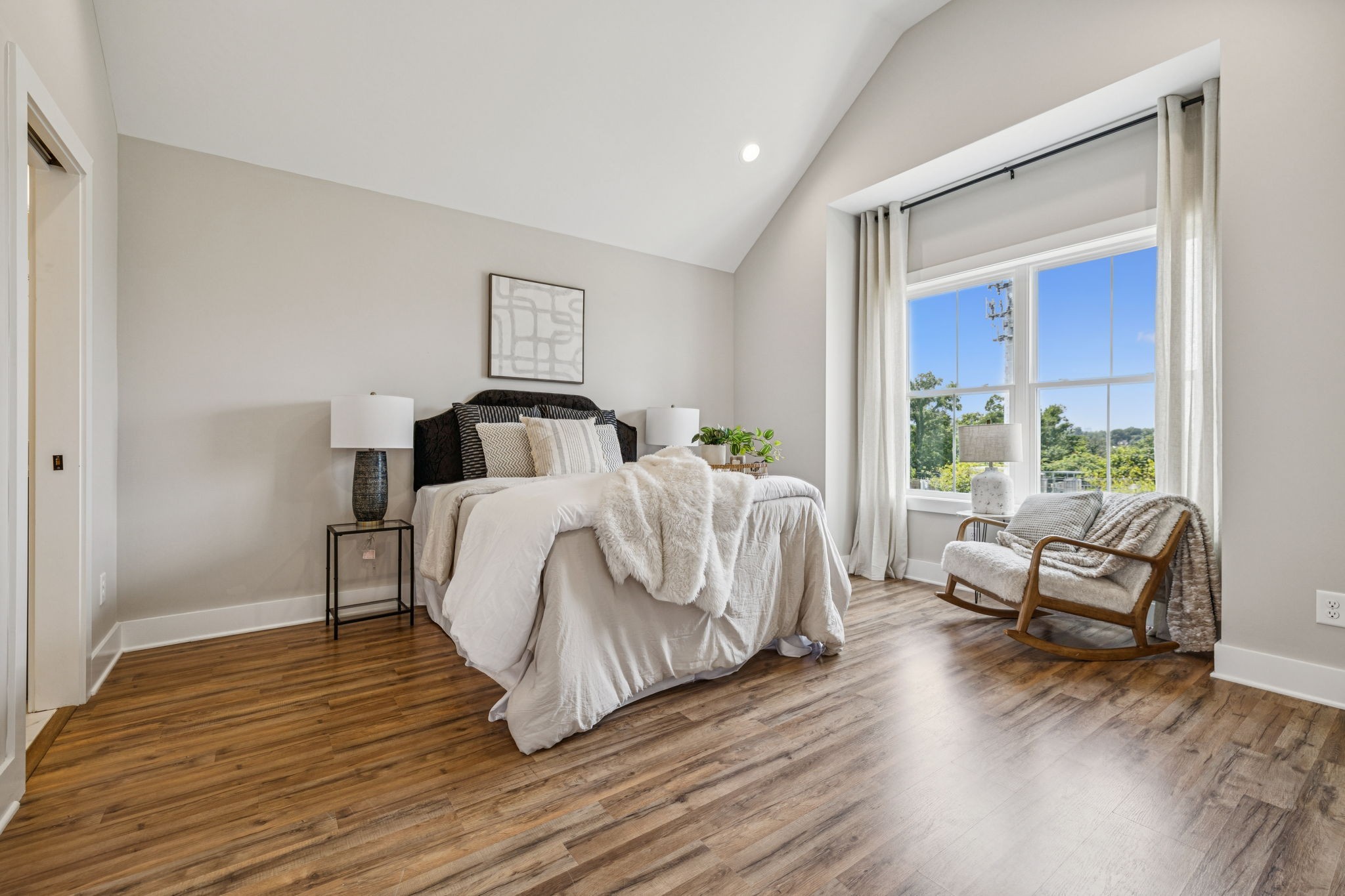 257 B Riverside Drive Nashville, TN 37206 - Photo 24 of 56 a bedroom with a bed and wooden floor