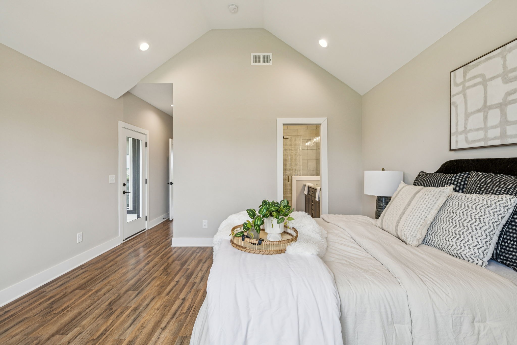 257 B Riverside Drive Nashville, TN 37206 - Photo 26 of 56 a bedroom with a bed and a painting on the wall