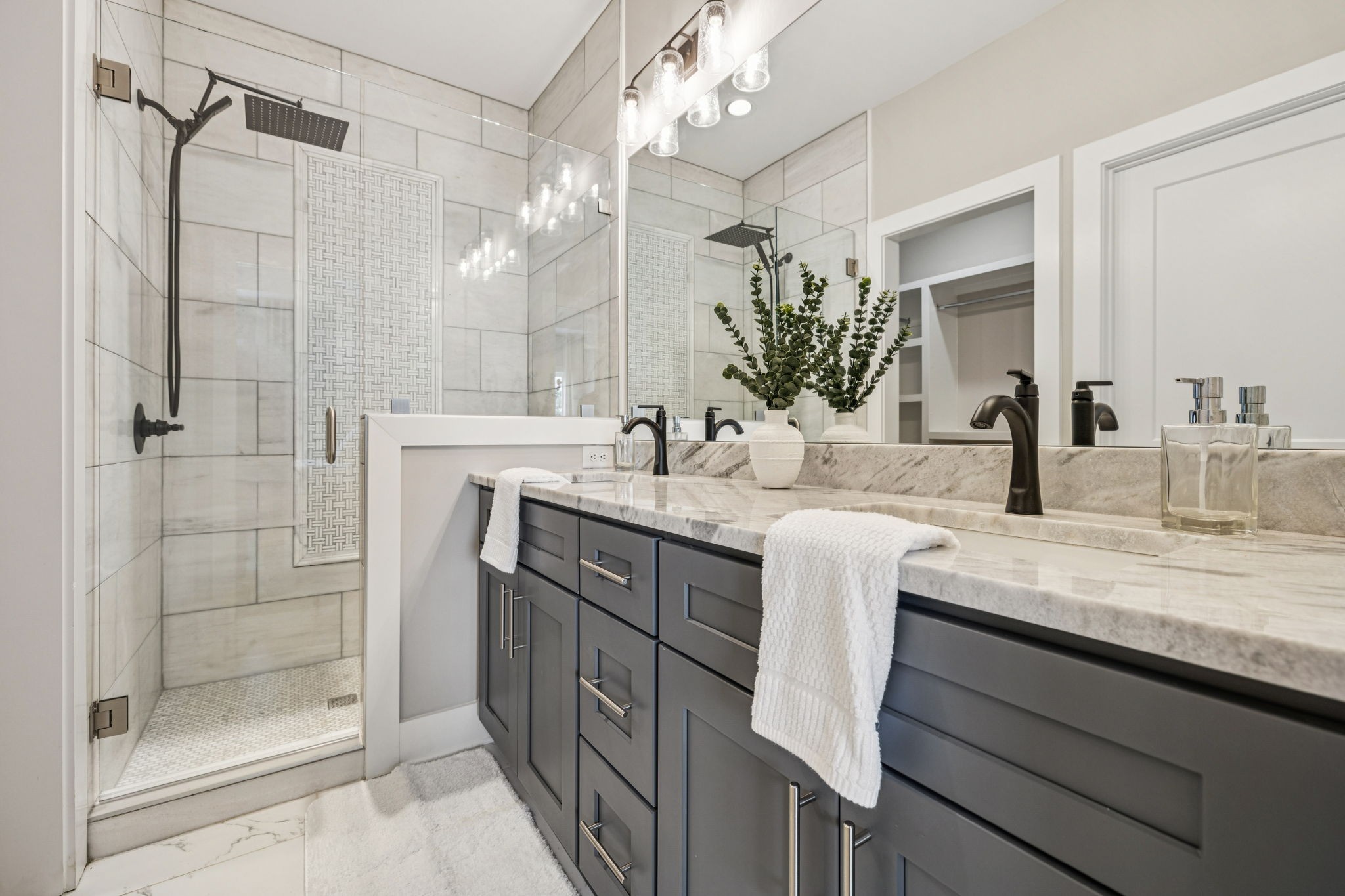 257 B Riverside Drive Nashville, TN 37206 - Photo 27 of 56 a bathroom with a double vanity sink mirror and shower