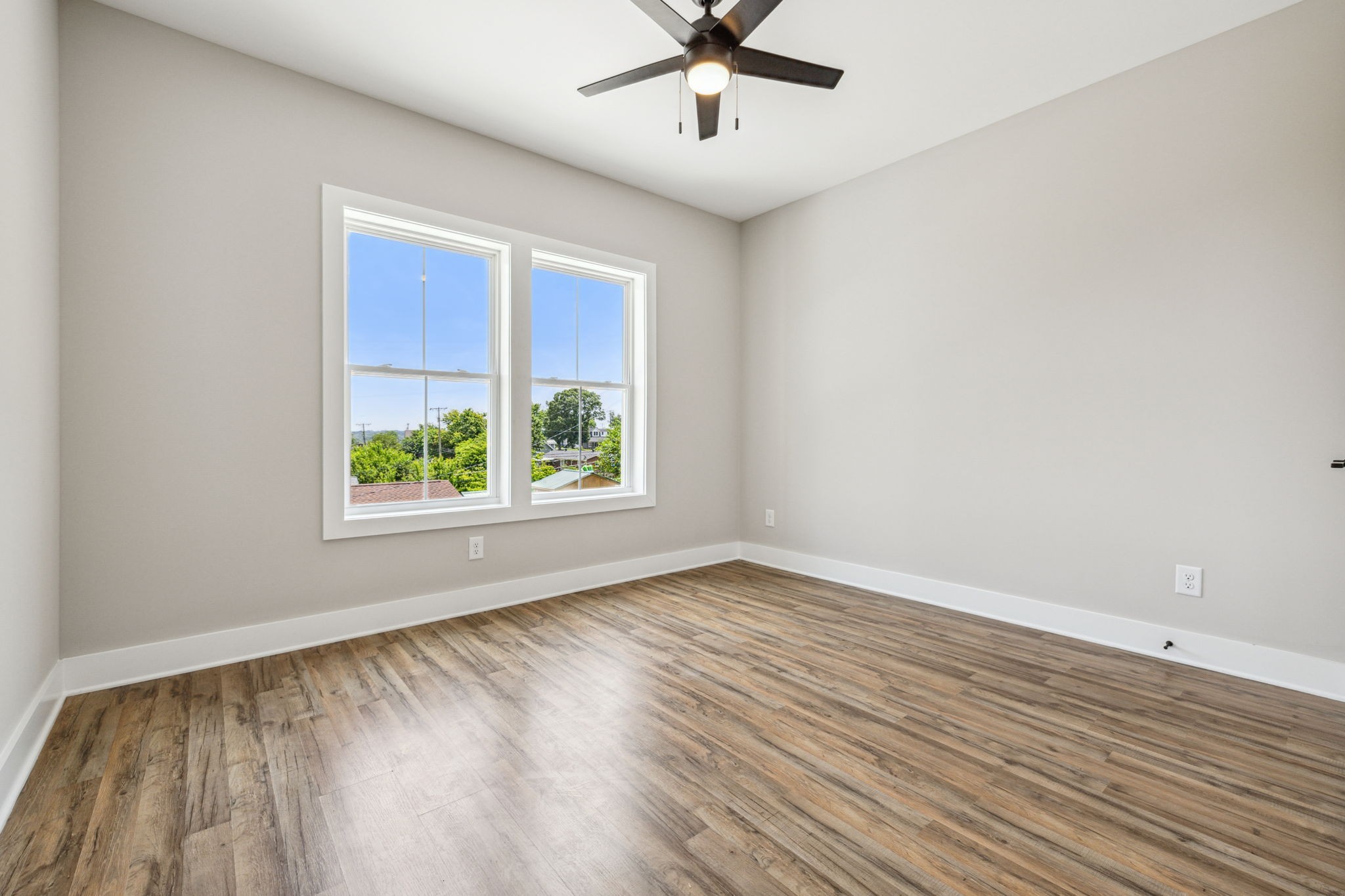 257 B Riverside Drive Nashville, TN 37206 - Photo 29 of 56 wooden floor in an empty room with a window