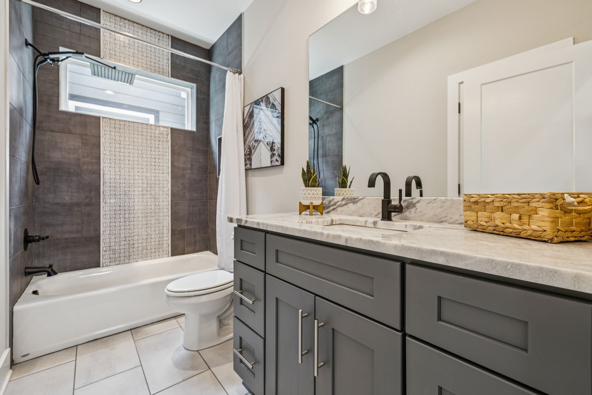 257 B Riverside Drive Nashville, TN 37206 - Photo 31 of 56 a bathroom with a sink a toilet and shower