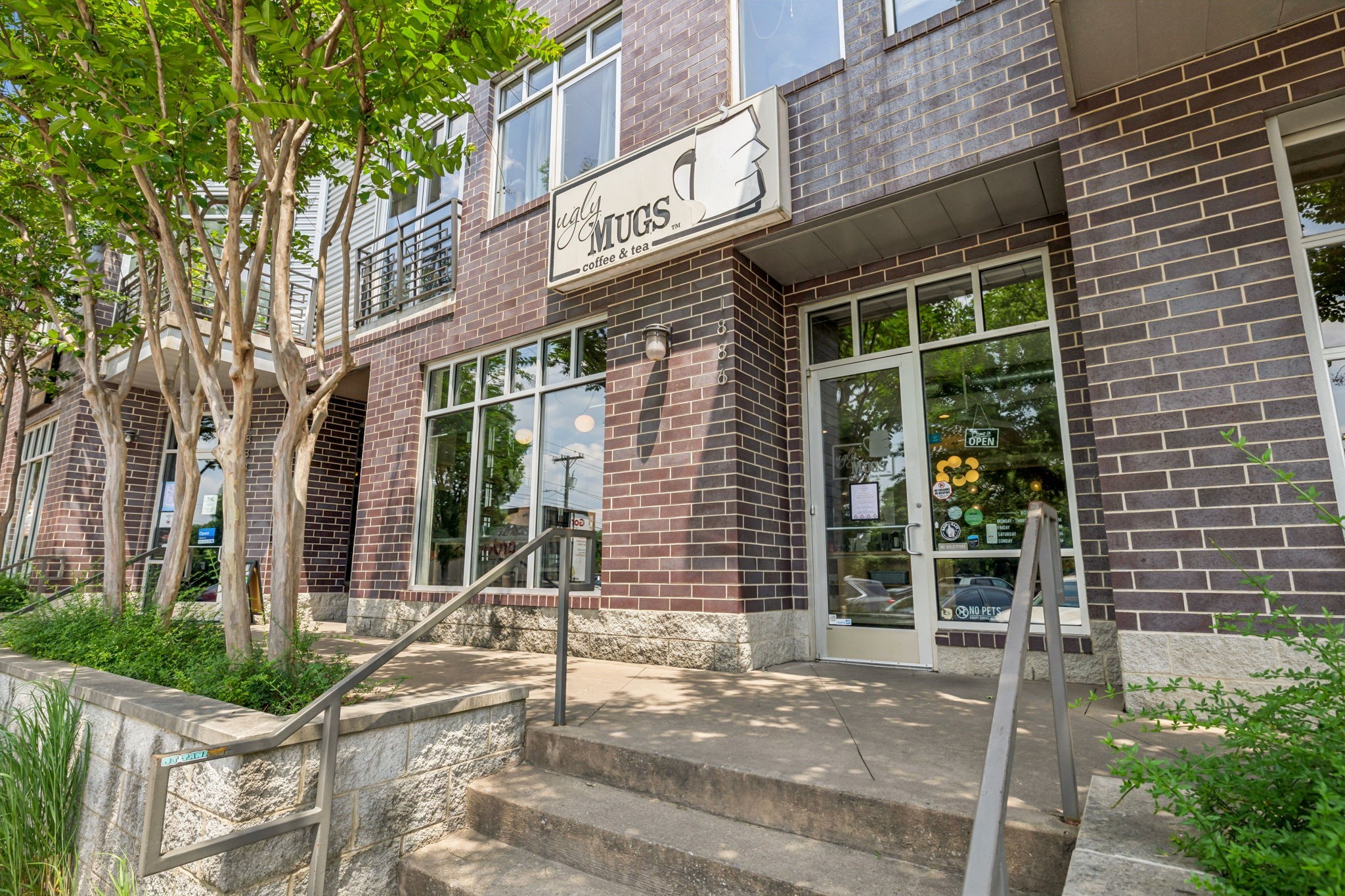 257 B Riverside Drive Nashville, TN 37206 - Photo 46 of 56 a view of a brick house with large windows