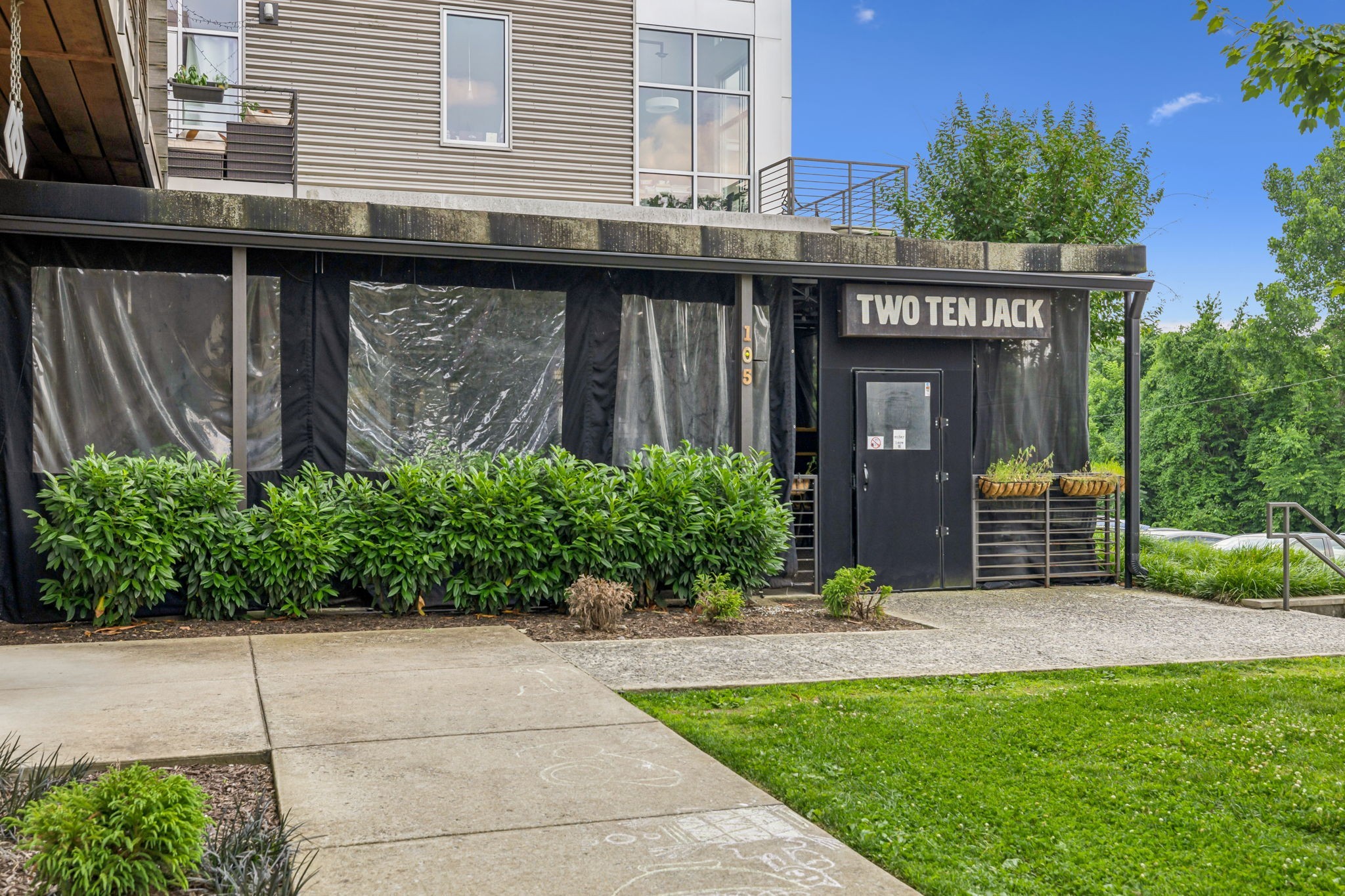 257 B Riverside Drive Nashville, TN 37206 - Photo 52 of 56 a view of a house with potted plants and a fountain