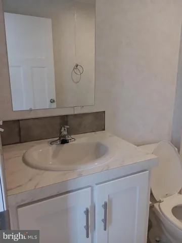 a bathroom with a sink and a toilet