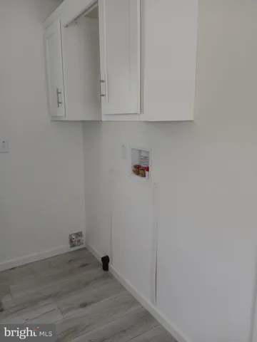 a view of cabinets and wooden floor