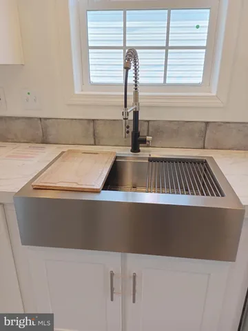 a view of kitchen sink and microwave