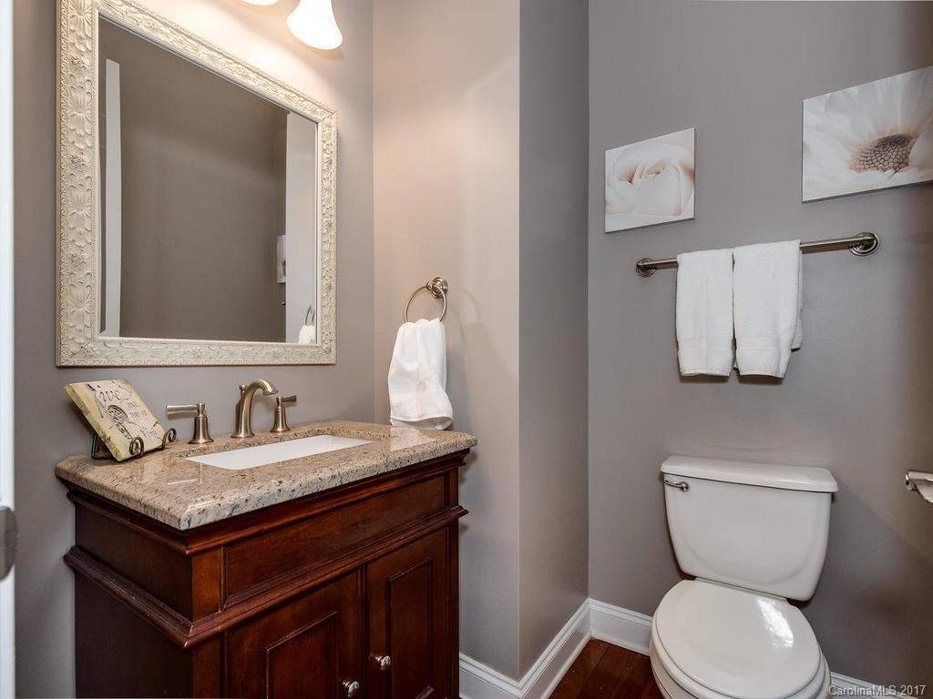 1940 Clark Elliot Street Fort Mill, SC 29708 - Photo 6 of 22 a bathroom with a toilet sink and mirror
