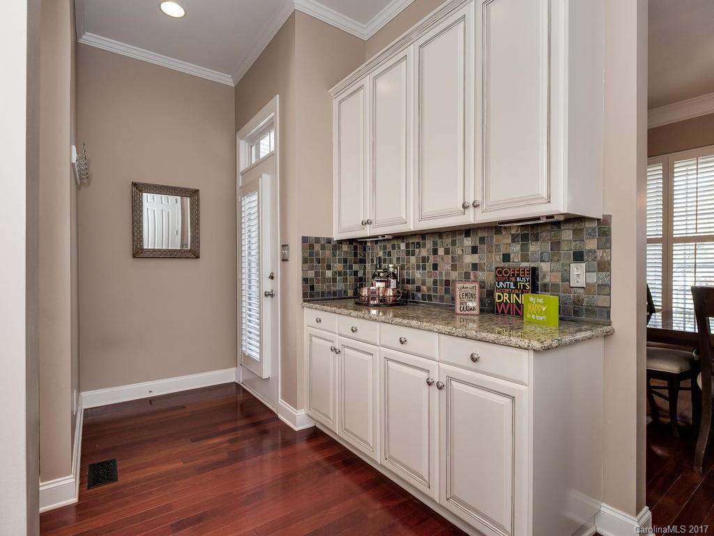 1940 Clark Elliot Street Fort Mill, SC 29708 - Photo 9 of 22 a kitchen with stainless steel appliances granite countertop a sink and cabinets