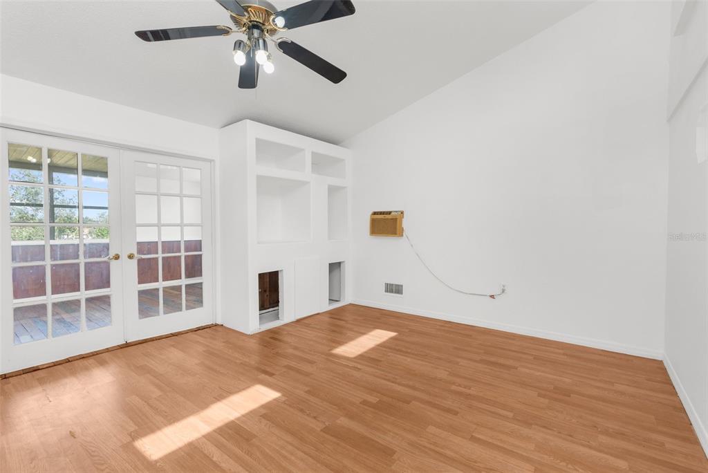 10221 Elgin Boulevard Spring Hill, FL 34608 - Photo 17 of 32 a bedroom with a bed and a window