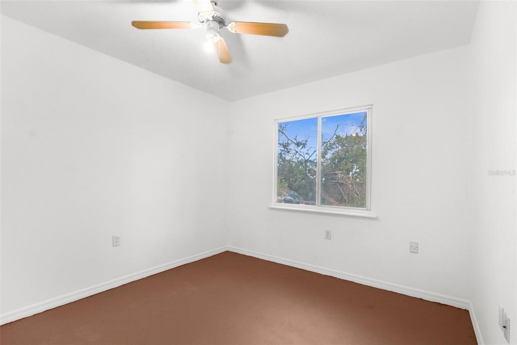 10221 Elgin Boulevard Spring Hill, FL 34608 - Photo 22 of 32 an empty room with a window