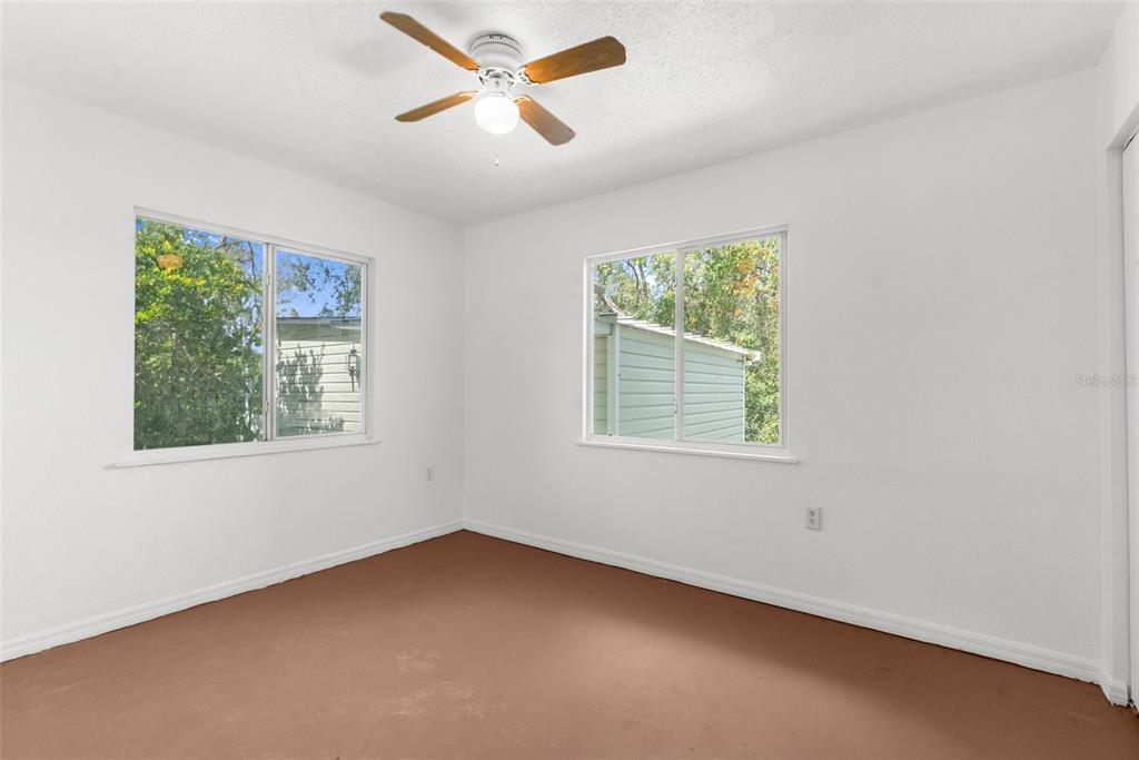 10221 Elgin Boulevard Spring Hill, FL 34608 - Photo 25 of 32 a view of an empty room with a window