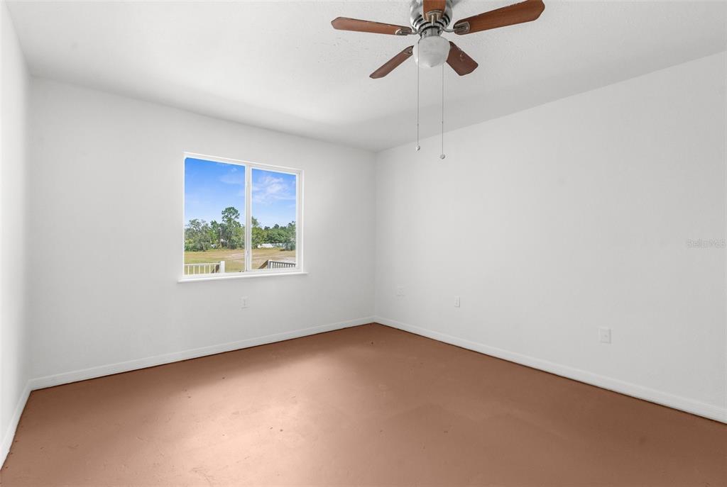 10221 Elgin Boulevard Spring Hill, FL 34608 - Photo 27 of 32 an empty room with a window