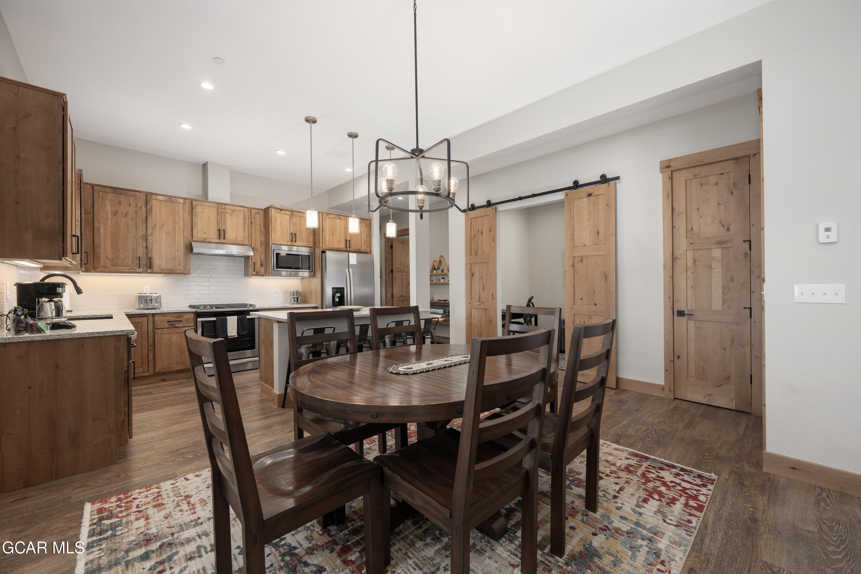 40 Springview Lane Fraser, CO 80442 - Photo 22 of 36 a view of a dining room and kitchen with a table chairs