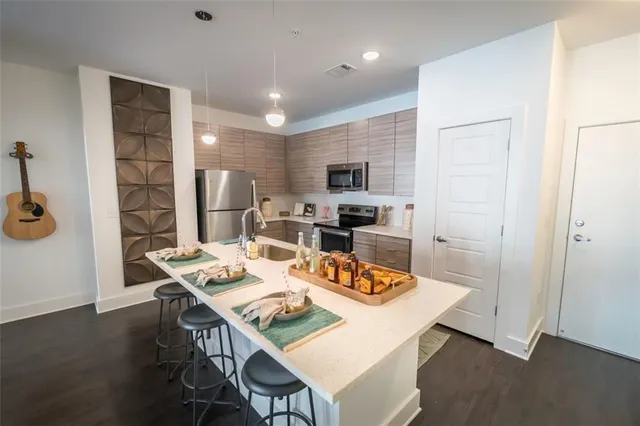 a living room with furniture a flat screen tv and a large window