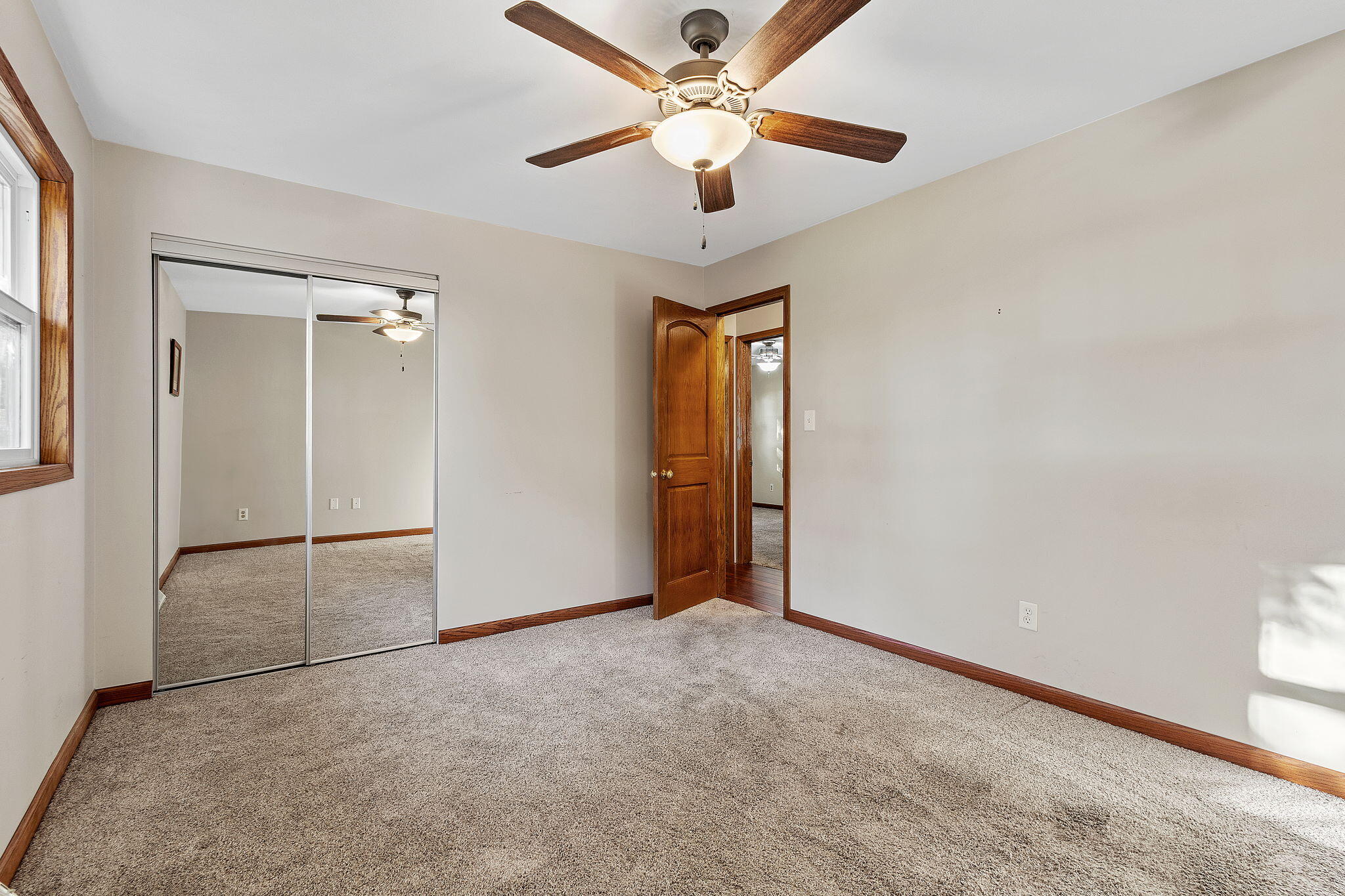 530 South 300 East Kouts, IN 46347 - Photo 20 of 42 an empty room with closet and a ceiling fan