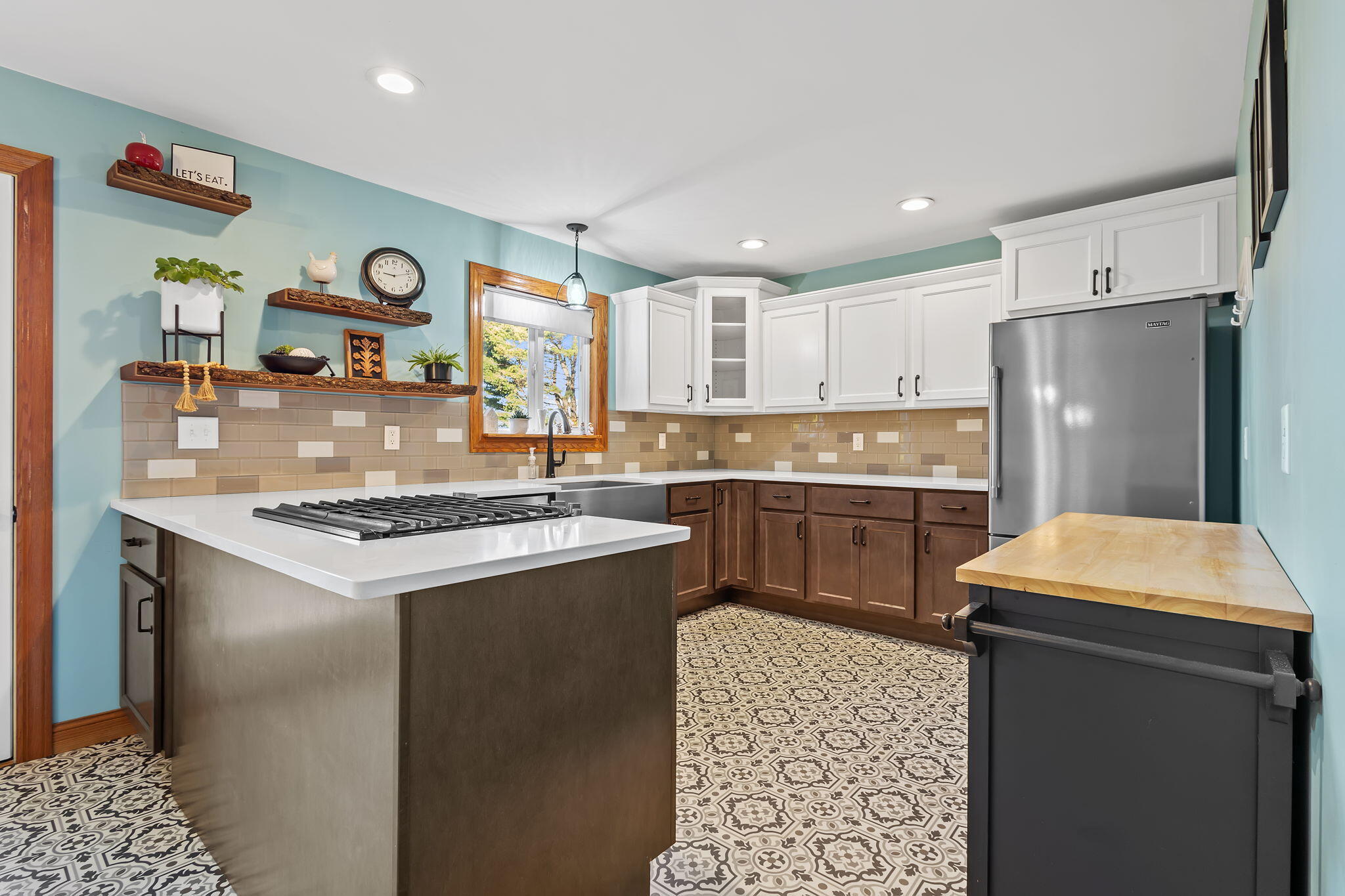 530 South 300 East Kouts, IN 46347 - Photo 9 of 42 a kitchen with a refrigerator a stove a sink and a oven with wooden floor