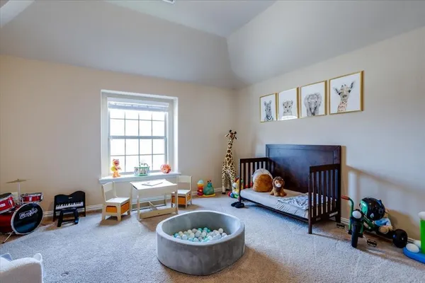 a living room with furniture toys and a window