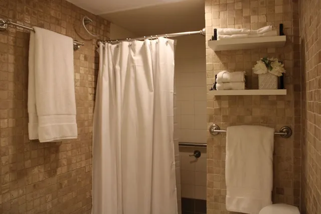 a bedroom with double bed and a night stand