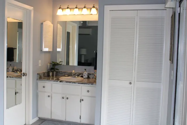a view of bedroom with furniture and a window