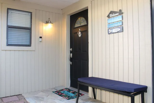 a view of a lake with a house in the background