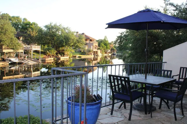 a view of a chairs and table in the patio
