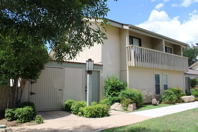 a view of a lake with a house in the background