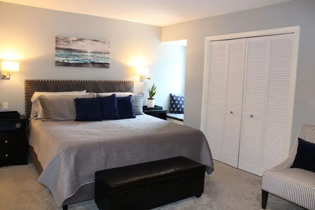 a bedroom with a bed and furniture