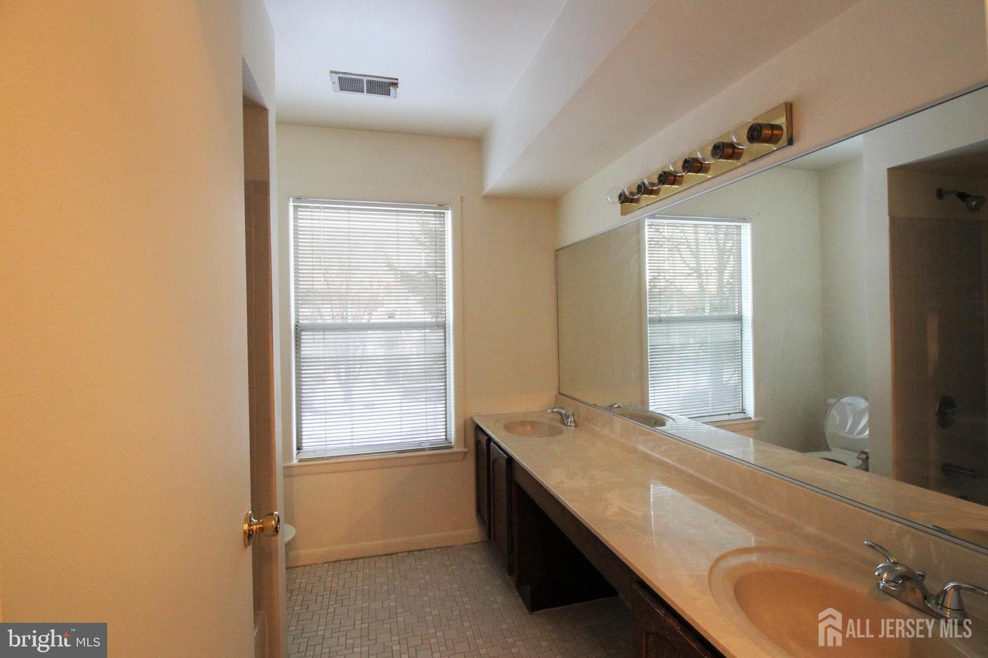 103 Claridge Court, Unit 5 Princeton, NJ 08540 - Photo 15 of 24 a room with two bed and a window