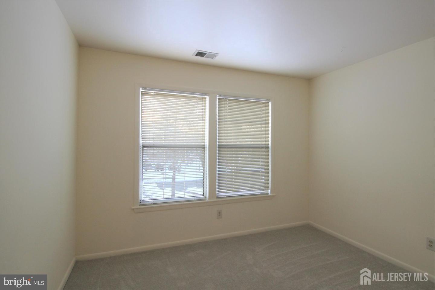 103 Claridge Court, Unit 5 Princeton, NJ 08540 - Photo 10 of 24 an empty room with a window
