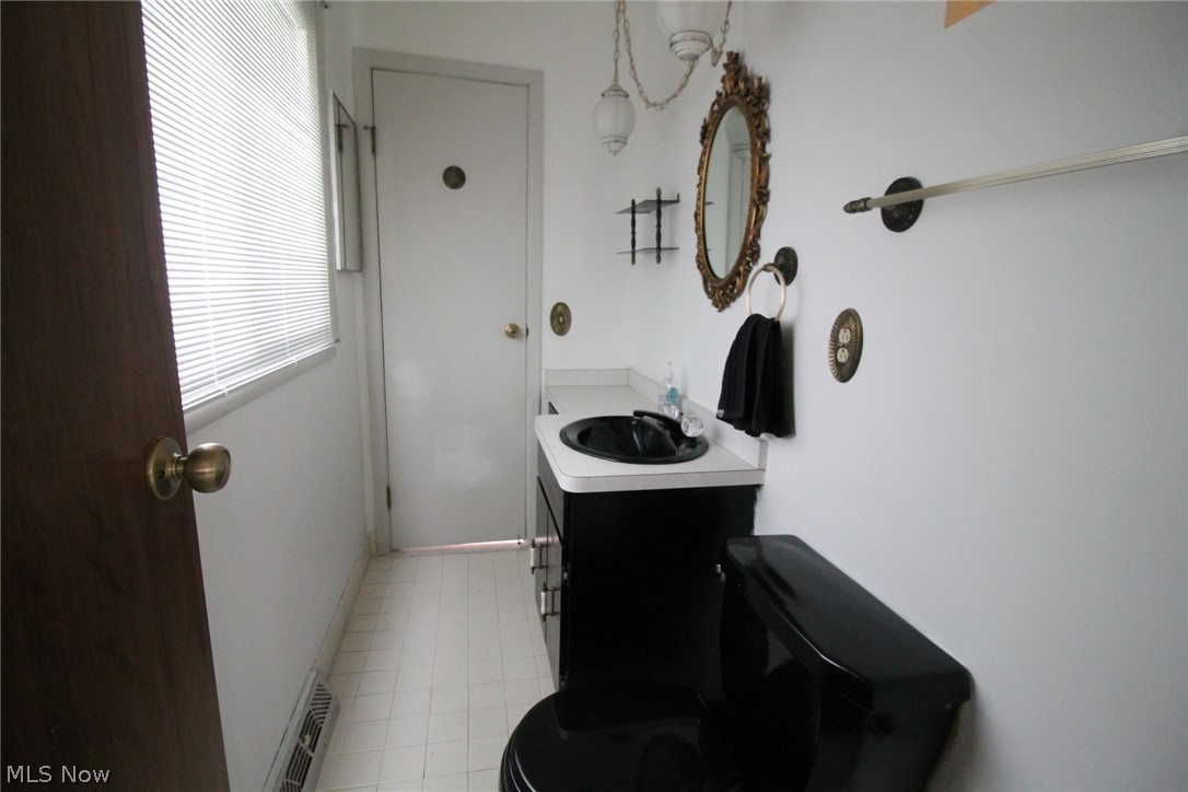 7930 Royal Ridge Drive Parma, OH 44129 - Photo 15 of 24 HALF BATH HASS ACCESS OFF THE FOYER AND THE MASTER BEDROOM