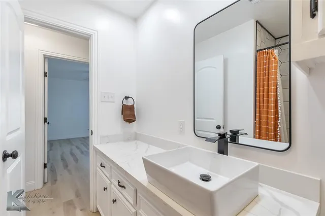 a bathroom with a sink and a mirror