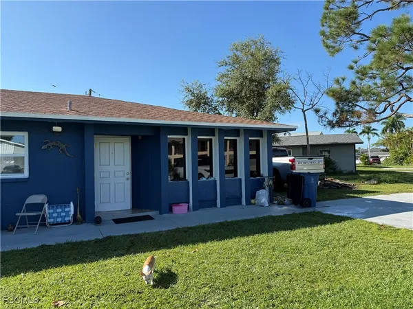 a view of an house with backyard porch and sitting area