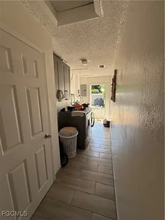 a room with furniture and gym equipment