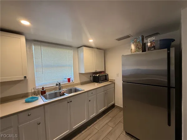 a kitchen with a sink and cabinets