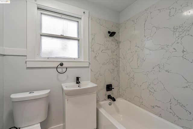 a bathroom with a sink a toilet and a bathtub