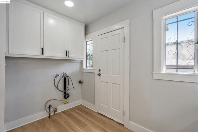 a view of a storage and utility room with window
